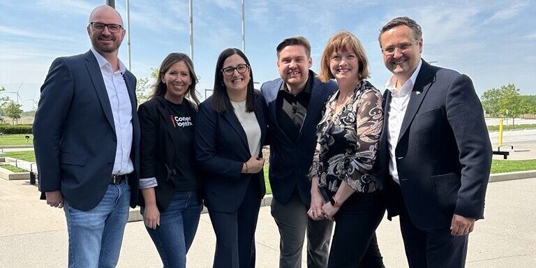 CCRF grant photo with WaveDirect A group of people standing on the sidewalk
