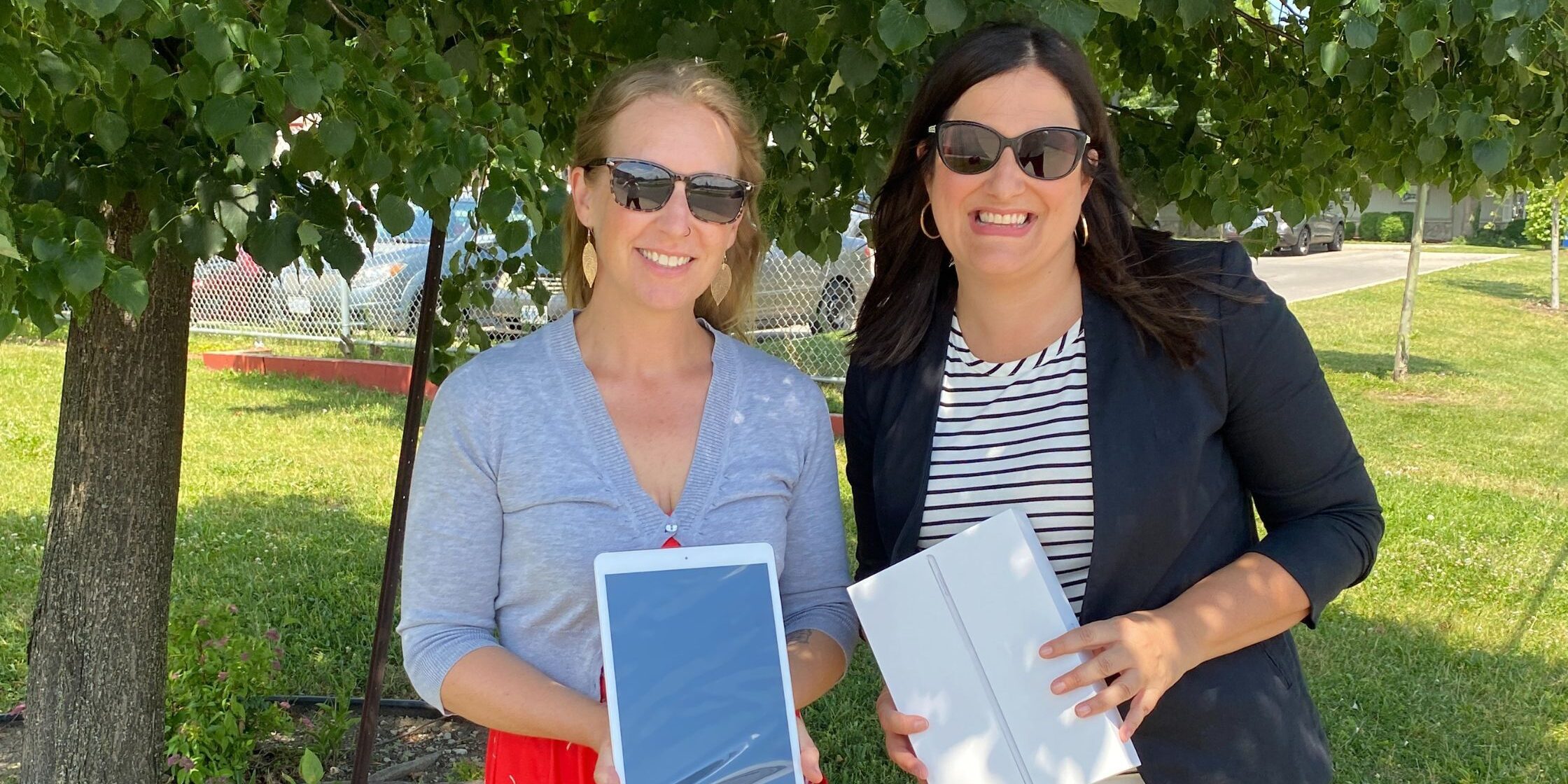 CWE and ProsperUs CWE CEO Joanne Soave presents iPads to ProsperUs as part of a donation.