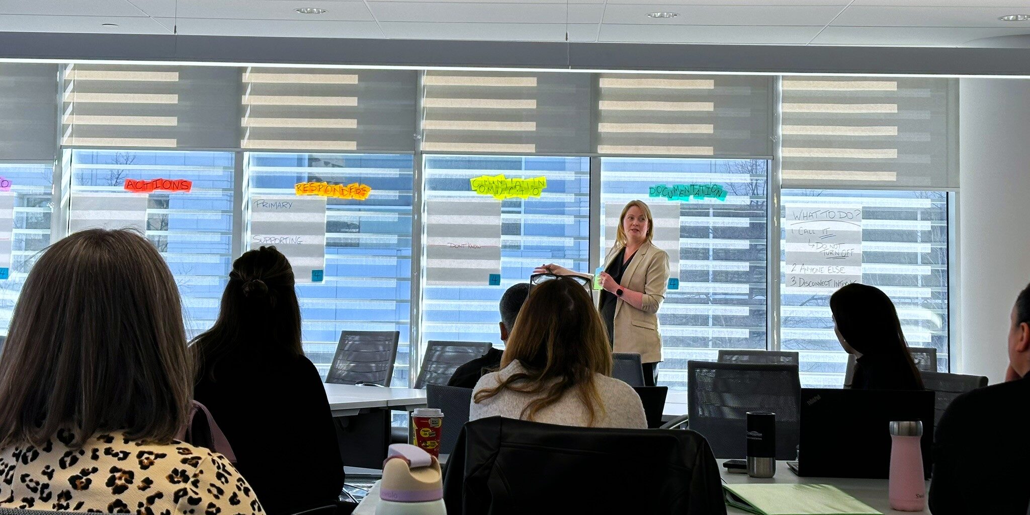 Laura facilitating the solution brainstorming session during a cybersecurity tabletop exercise.