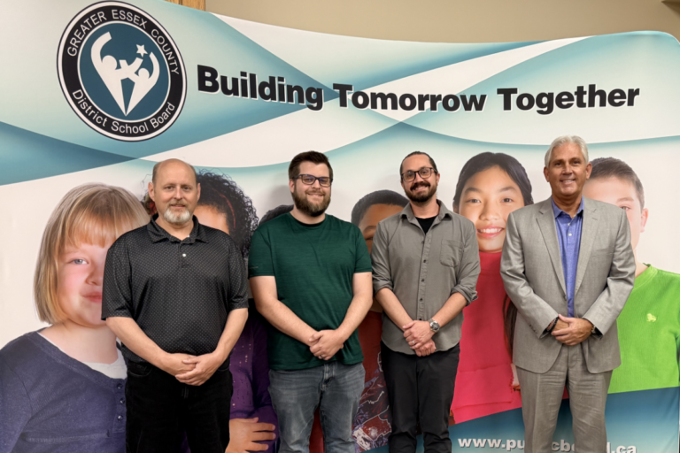 GECDSB team in front of banner