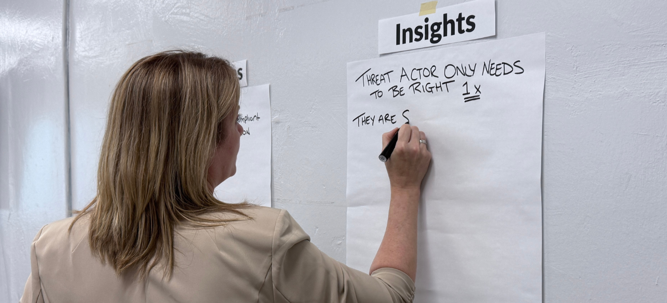 Woman writing on whiteboard during a BCP exercise